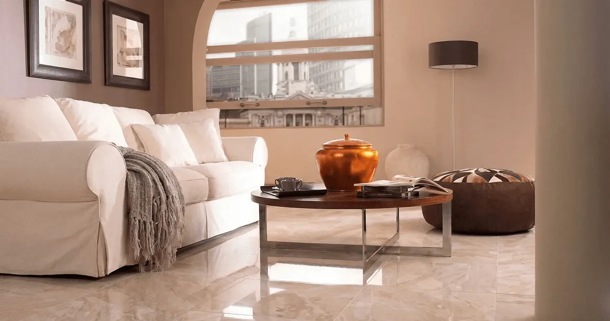 Modern living room with professionally installed marble flooring, a beige sofa, coffee table in Pembroke Pines, FL